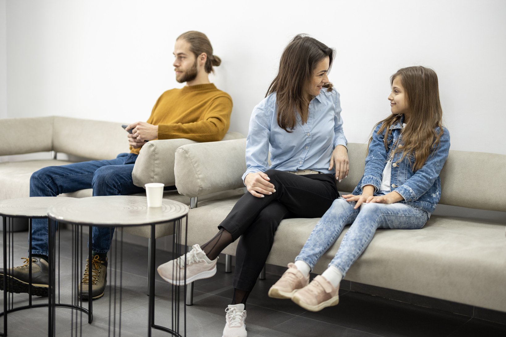 People Sitting on the Couch at the Waiting Room